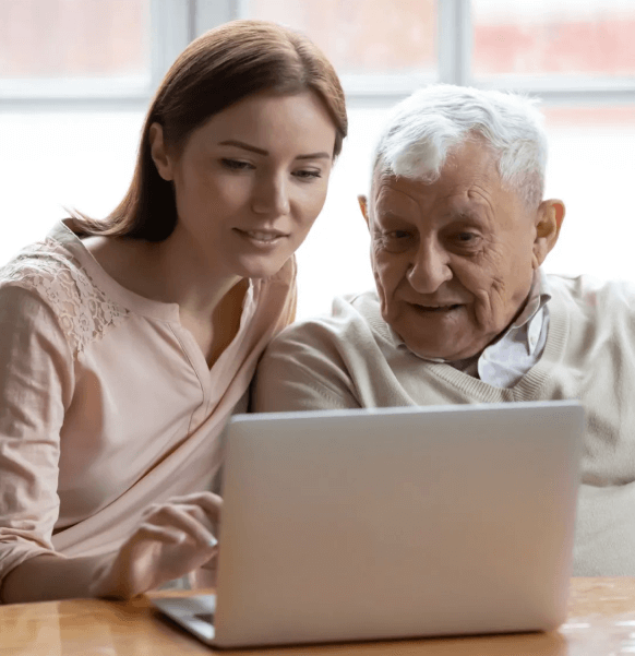 Granddaughter helping grandfather with Photo